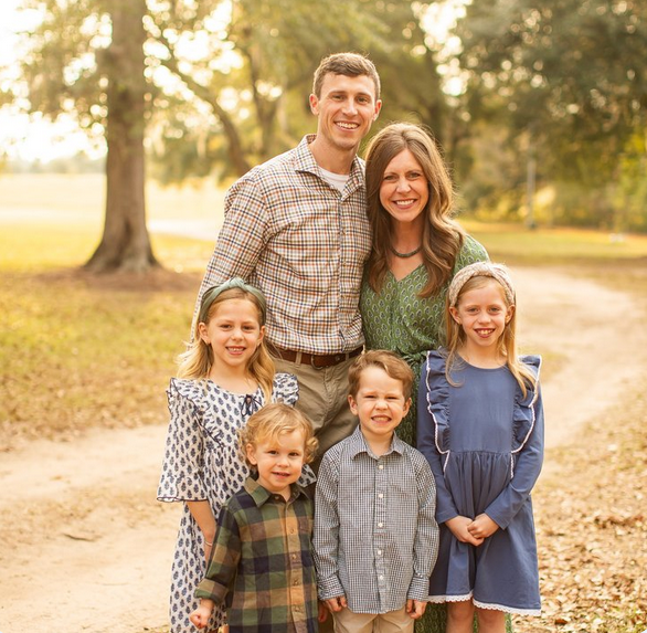 Dr. John DuRant with his wife and four children in a family photo outdoors