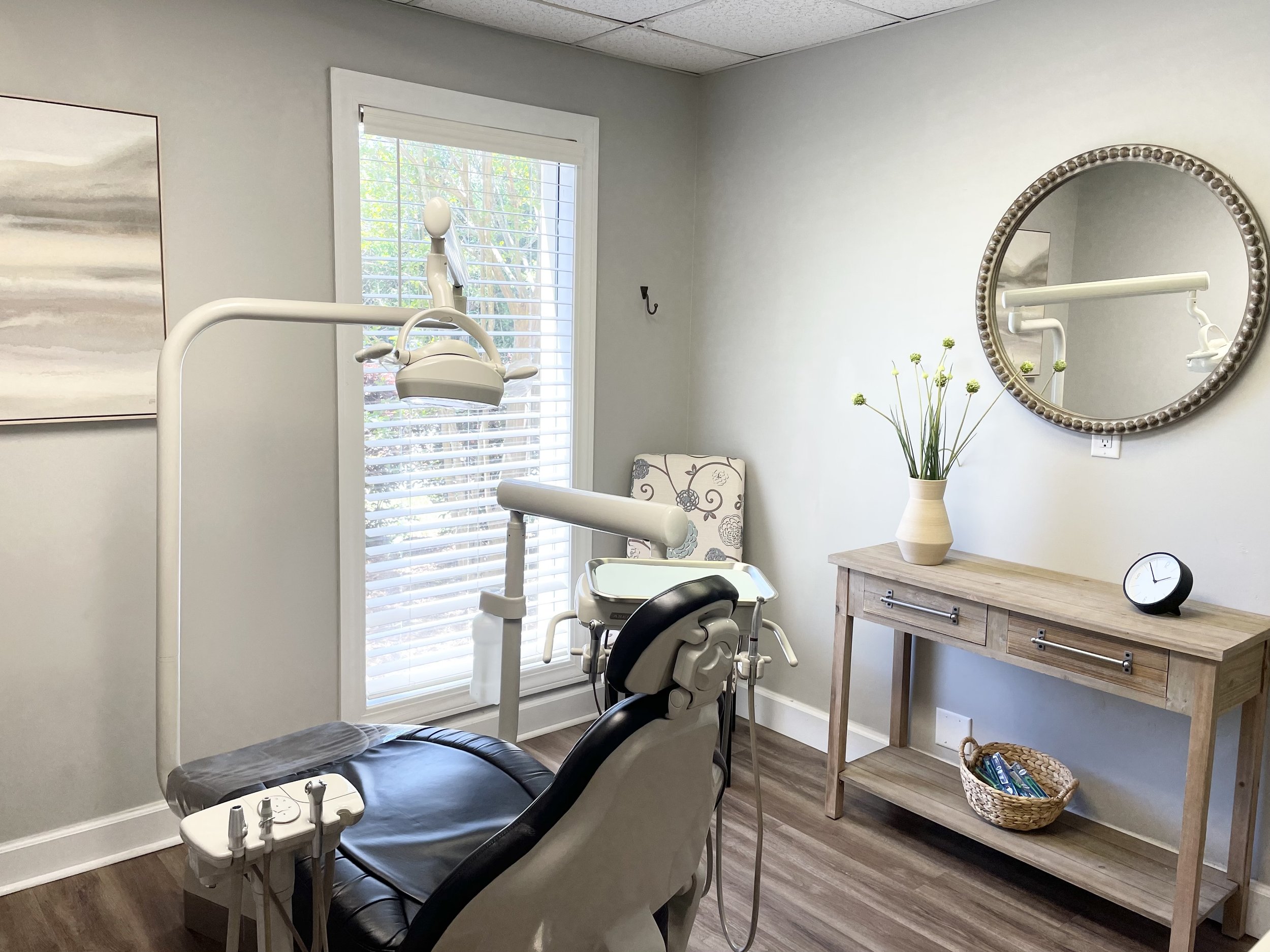 Dental treatment room at Cross County Dentistry in North Charleston, featuring a modern dental chair and natural lighting