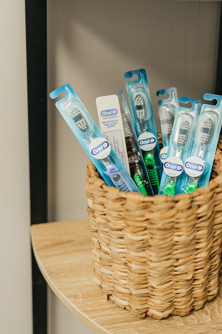 A basket of Oral-B toothbrushes at Cross County Dentistry in North Charleston, SC