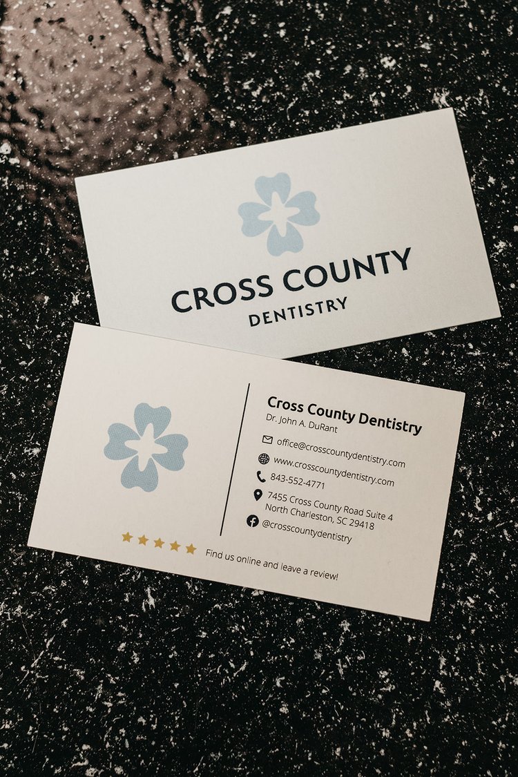 Business cards for Cross County Dentistry with contact information in North Charleston, SC